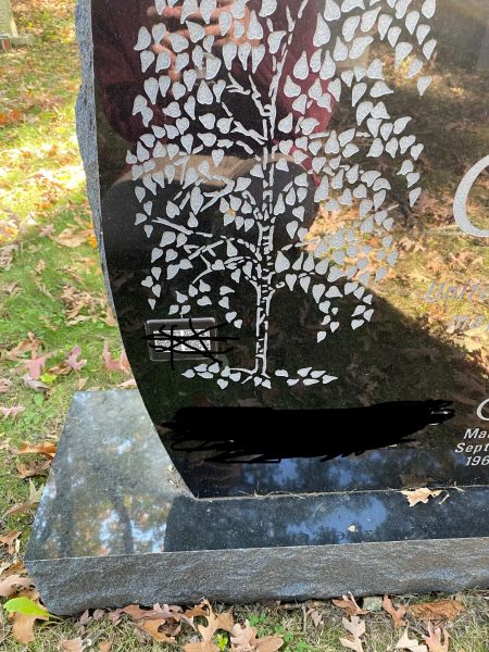 Gravestone with publication list. Photo Justin Joque.